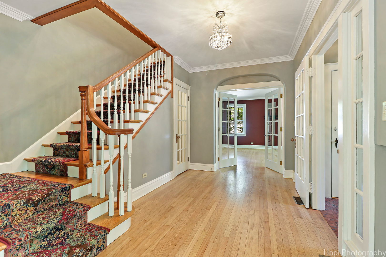 1403 Glenview Road Glenview, IL 60025 - Photo 5 of 62 a view of a hallway with wooden floor and staircase