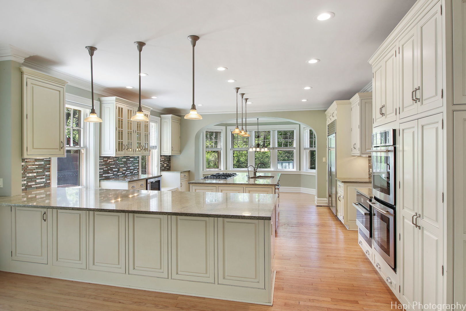 1403 Glenview Road Glenview, IL 60025 - Photo 10 of 62 a kitchen with stainless steel appliances granite countertop a refrigerator a sink and a wooden floors