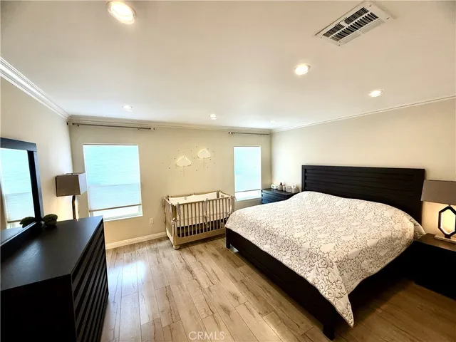 a bedroom with a bed and a desk