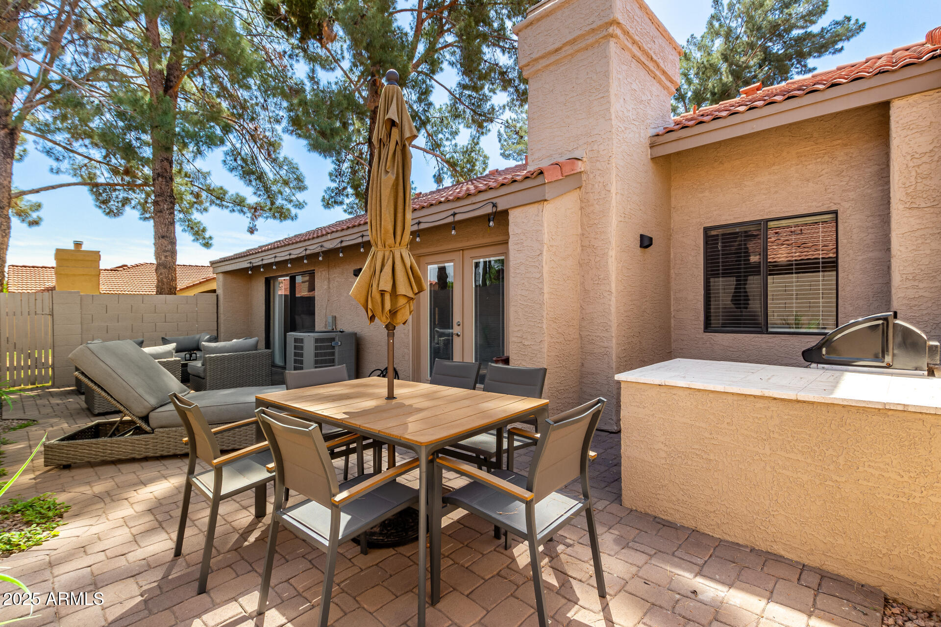 945 North Pasadena, Unit 62 Mesa, AZ 85201 - Photo 12 of 30 a view of a patio with table and chairs and potted plants