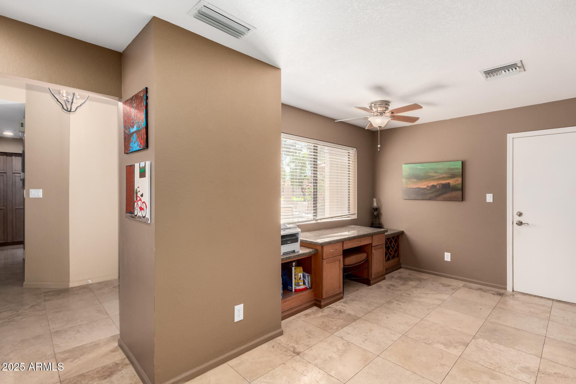 945 North Pasadena, Unit 62 Mesa, AZ 85201 - Photo 13 of 30 a view of a kitchen with furniture and a ceiling fan
