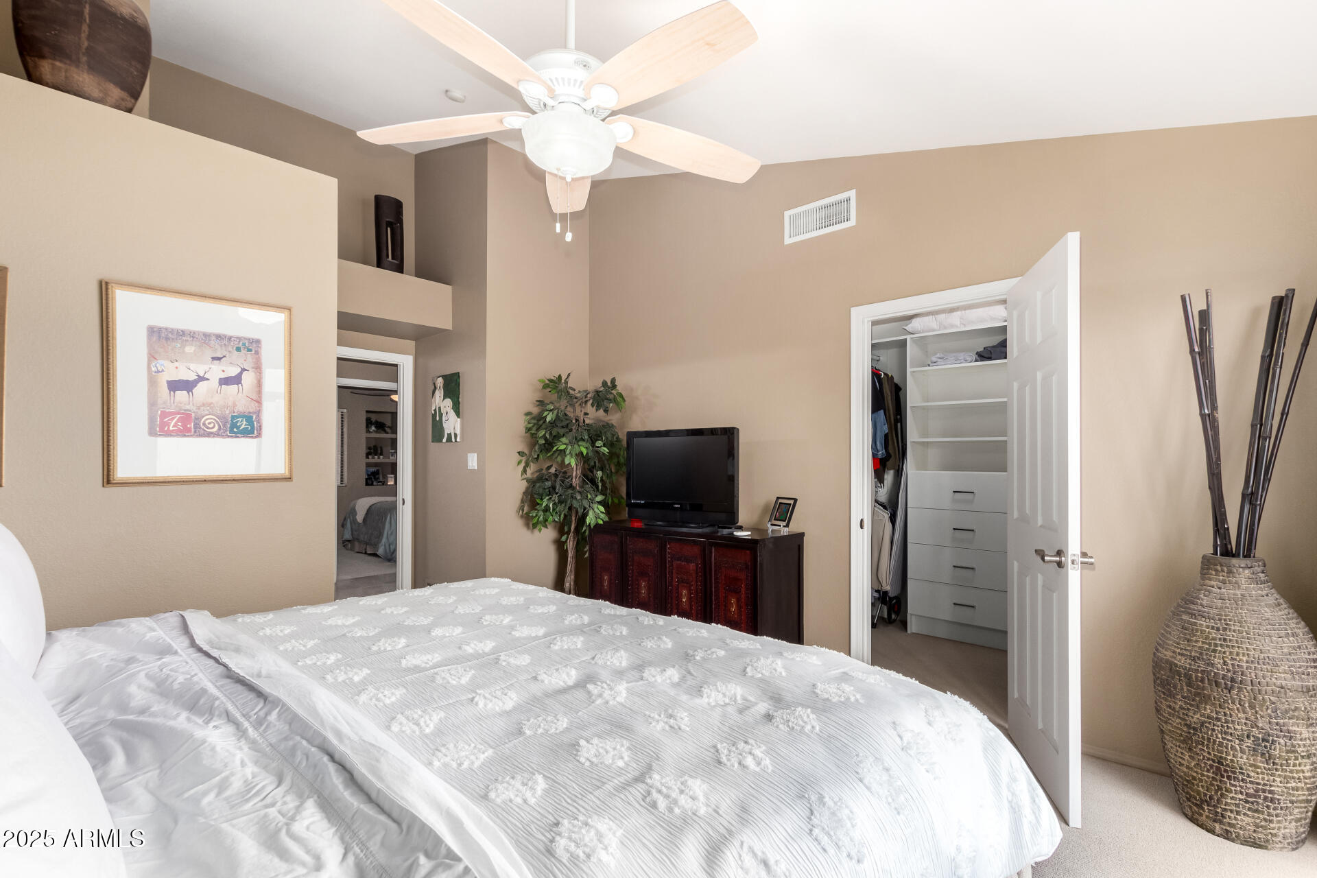 945 North Pasadena, Unit 62 Mesa, AZ 85201 - Photo 21 of 30 a bedroom with a bed and a chandelier