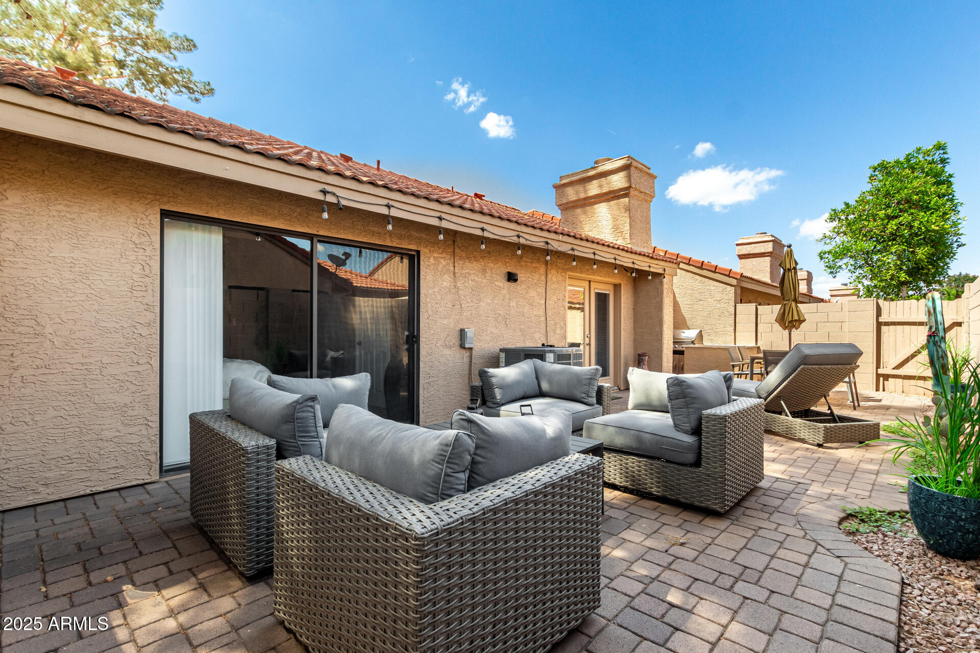 945 North Pasadena, Unit 62 Mesa, AZ 85201 - Photo 27 of 30 a balcony with furniture and a potted plant