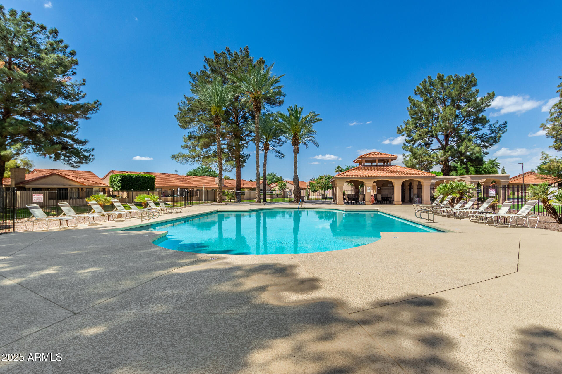 945 North Pasadena, Unit 62 Mesa, AZ 85201 - Photo 29 of 30 a view of a swimming pool with a patio