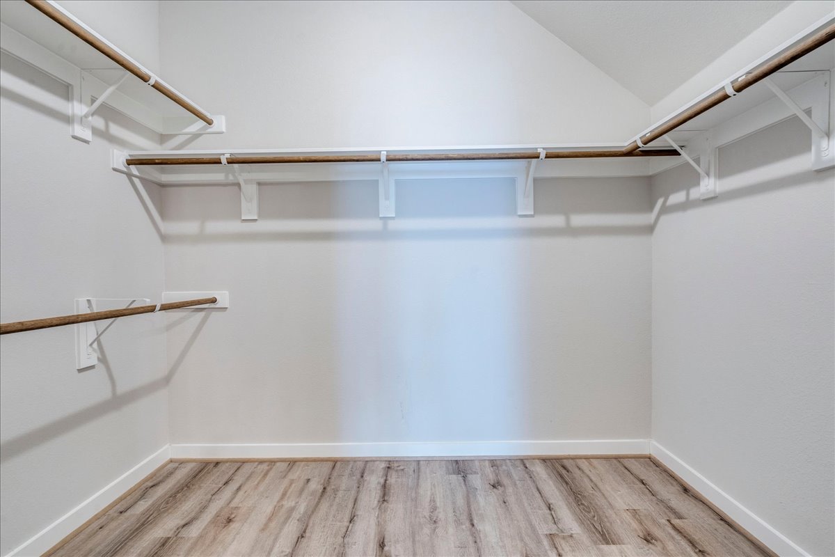 144 Threshing Road, Unit A Buda, TX 78610 - Photo 18 of 35 Primary bedroom walk-in closet