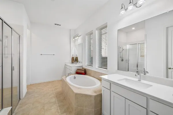 a bathroom with a sink double vanity and a mirror