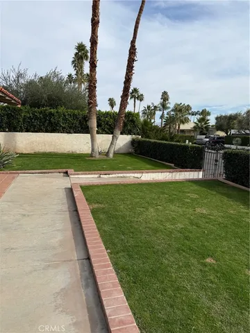 a bed room with a bed and a chair