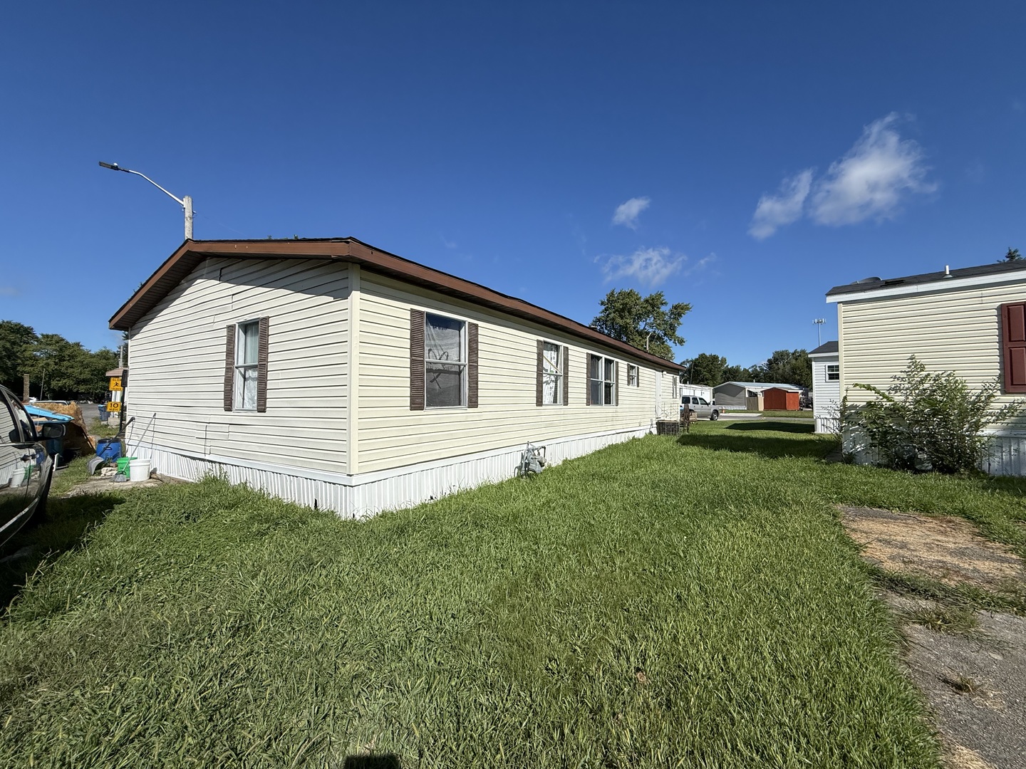 1995 Schuyler Avenue, Unit D25 Kankakee, IL 60901 - Photo 1 of 13 a front view of a house with a yard