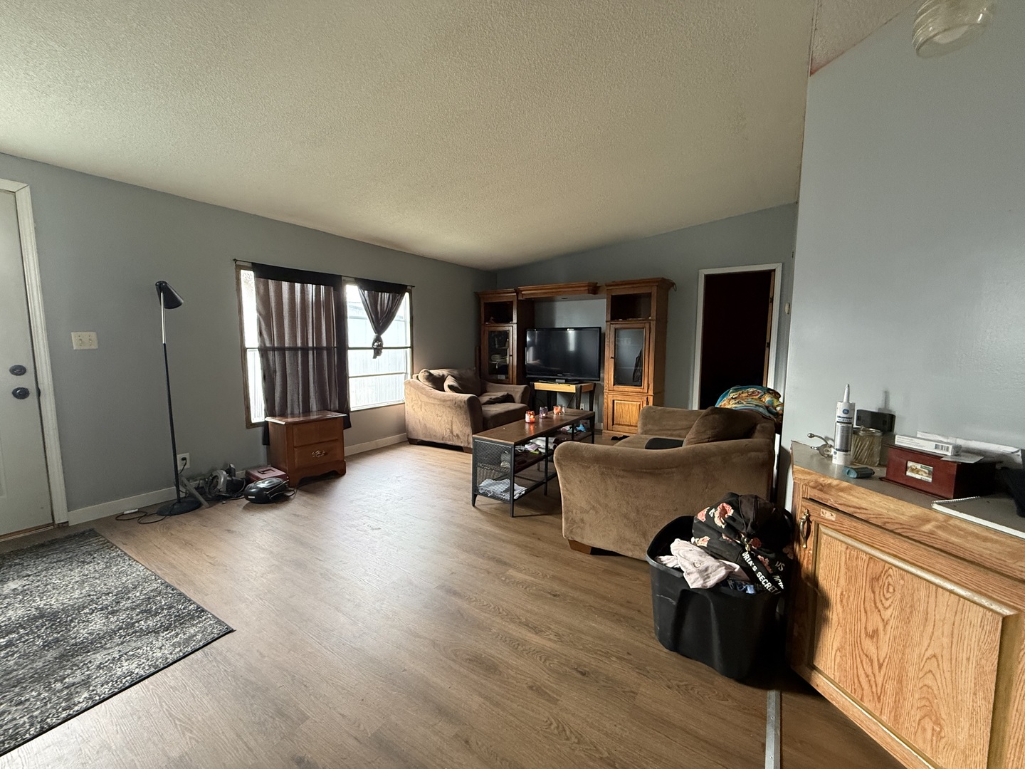 1995 Schuyler Avenue, Unit D25 Kankakee, IL 60901 - Photo 3 of 13 a living room with furniture and a wooden floor