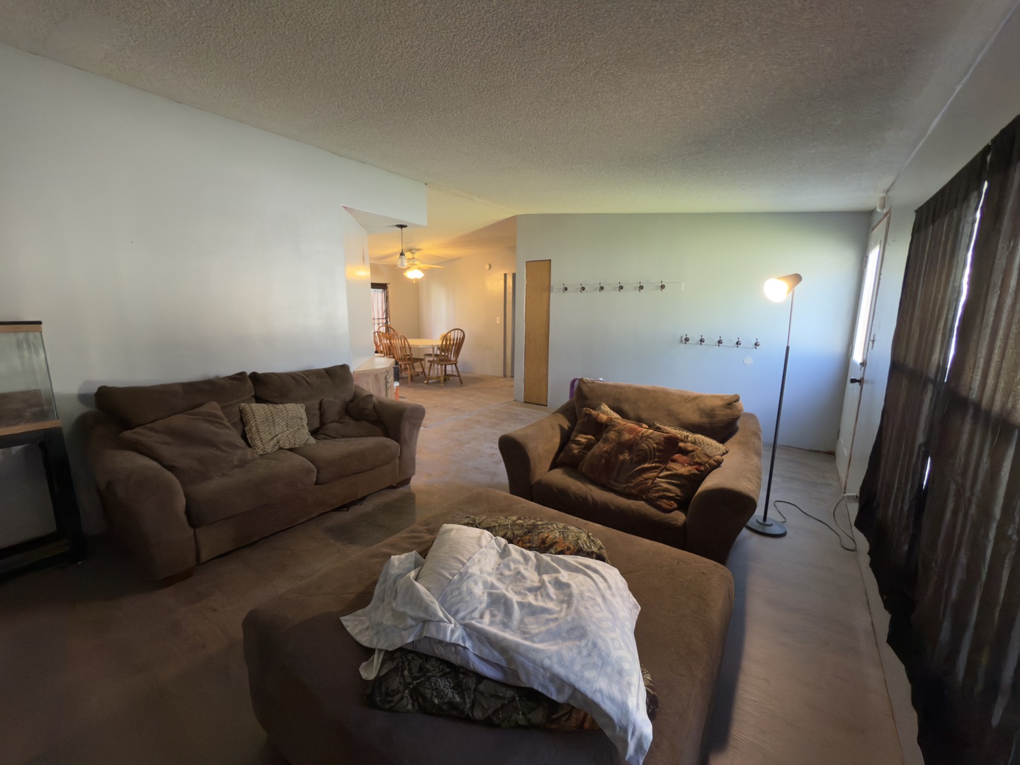 1995 Schuyler Avenue, Unit D25 Kankakee, IL 60901 - Photo 4 of 13 a living room with furniture and a mirror