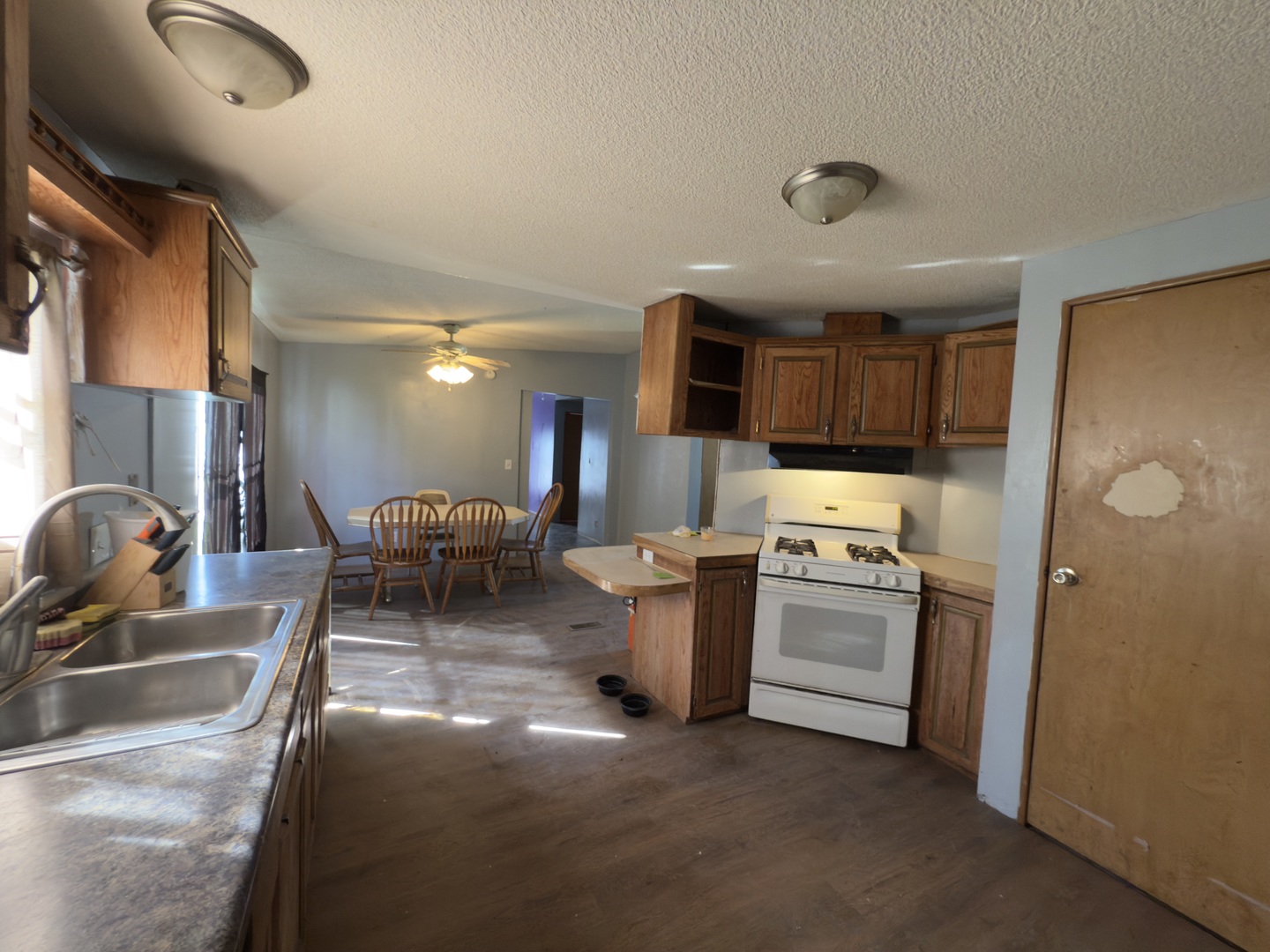 1995 Schuyler Avenue, Unit D25 Kankakee, IL 60901 - Photo 5 of 13 a kitchen with a sink stainless steel appliances and cabinets