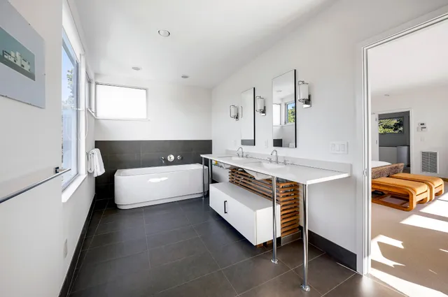 a bedroom with a bed and a couch