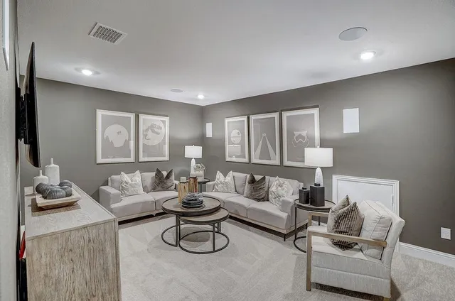 a bathroom with a sink a toilet a mirror a vanity and shower