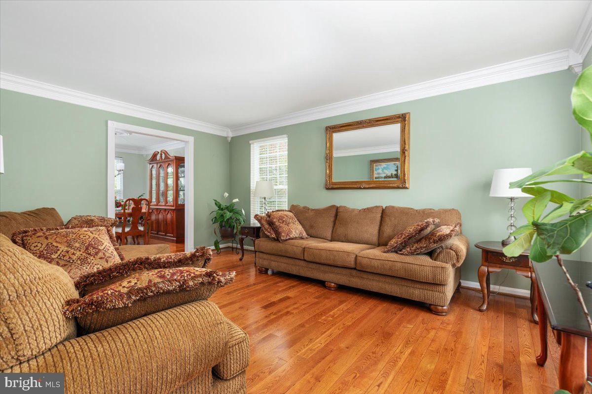 8236 Sunset Drive Manassas, VA 20110 - Photo 11 of 53 a living room with furniture and a wooden floor