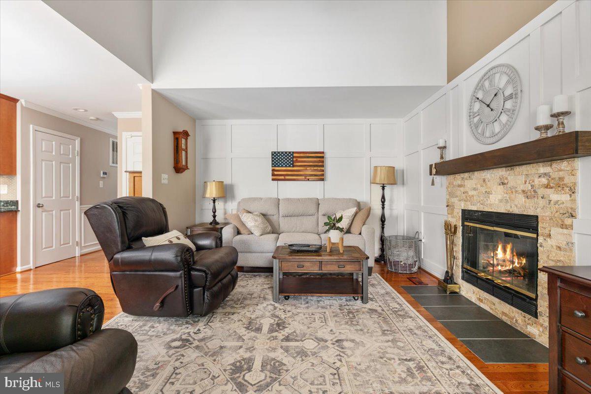 8236 Sunset Drive Manassas, VA 20110 - Photo 20 of 53 a living room with furniture and a fireplace