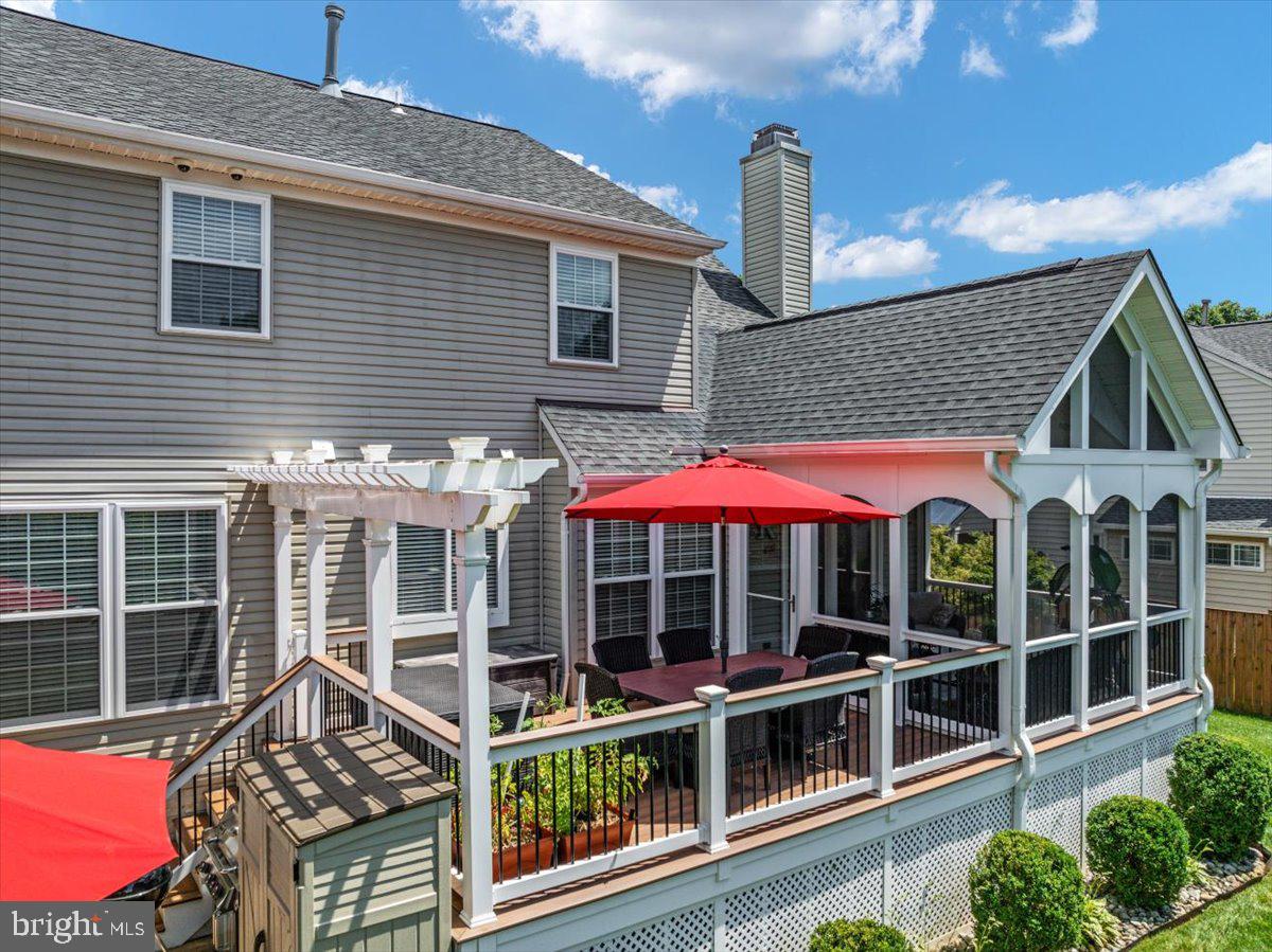 8236 Sunset Drive Manassas, VA 20110 - Photo 26 of 53 a view of a house with a porch and furniture