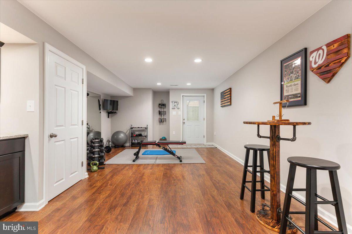 8236 Sunset Drive Manassas, VA 20110 - Photo 31 of 53 a view of a livingroom with furniture and hardwood floor