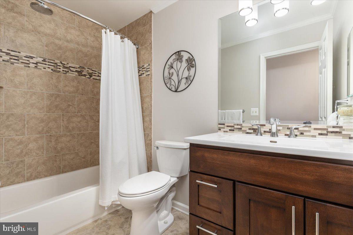 8236 Sunset Drive Manassas, VA 20110 - Photo 35 of 53 a bathroom with a sink a toilet and a bathtub