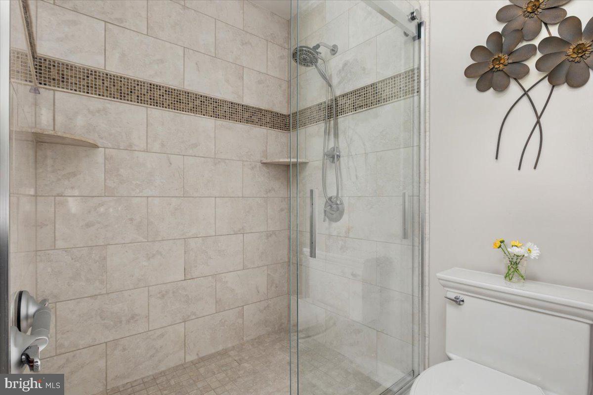 8236 Sunset Drive Manassas, VA 20110 - Photo 40 of 53 a bathroom with a shower and a shower