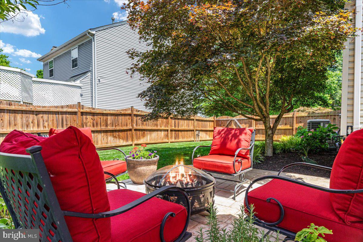 8236 Sunset Drive Manassas, VA 20110 - Photo 45 of 53 a view of a chairs and table in the patio