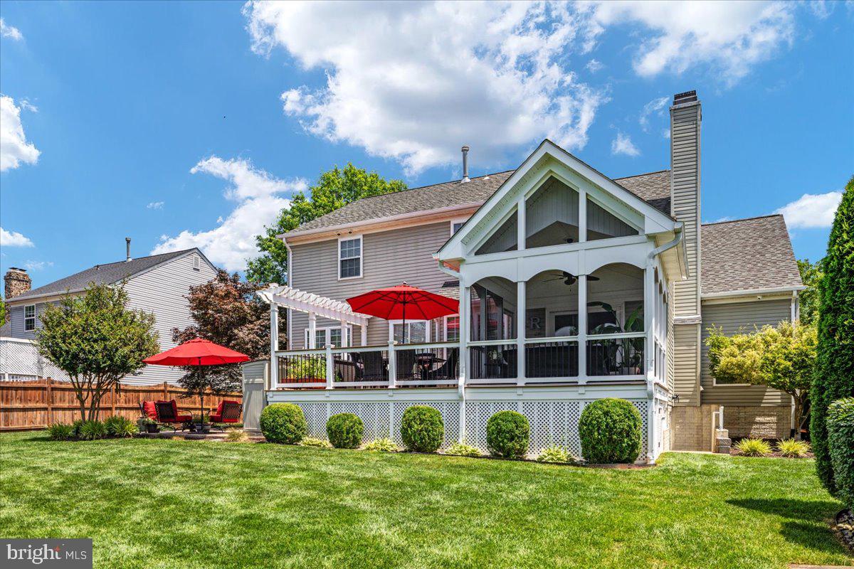 8236 Sunset Drive Manassas, VA 20110 - Photo 5 of 53 a front view of house with yard and swimming pool