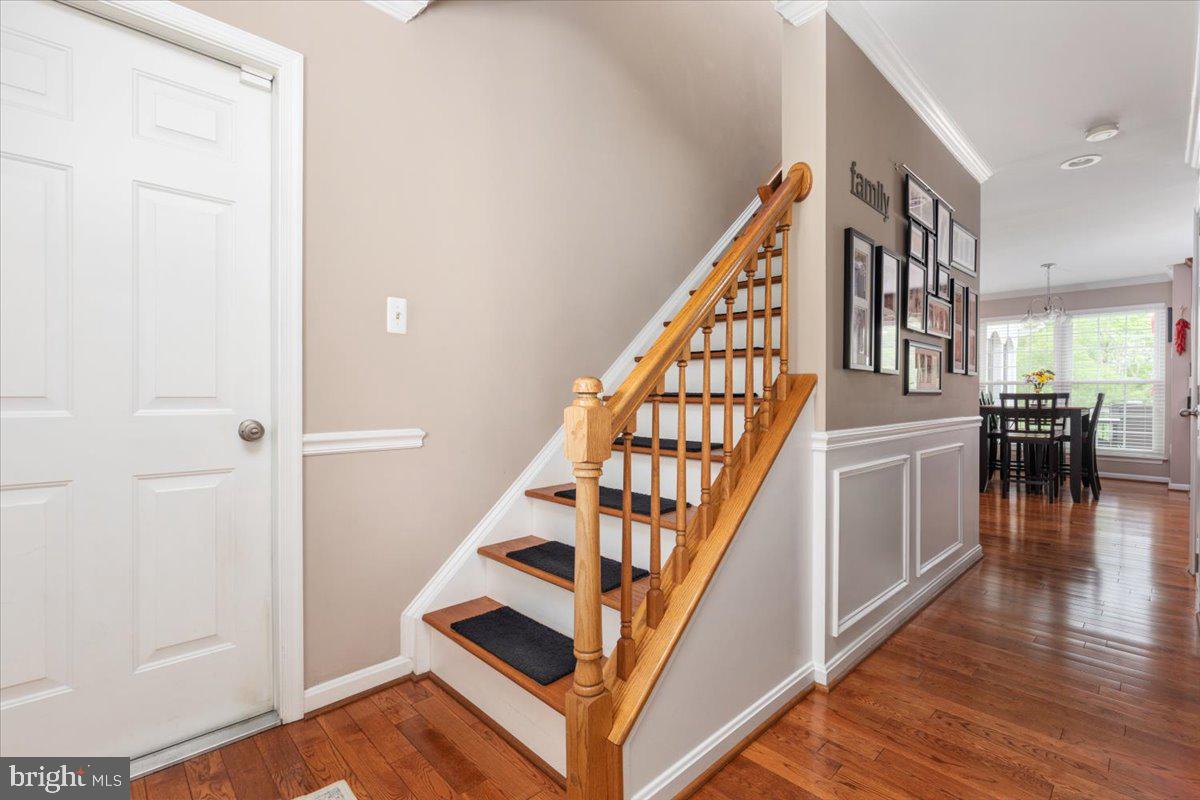 8236 Sunset Drive Manassas, VA 20110 - Photo 9 of 53 a view of entryway and hall with wooden floor