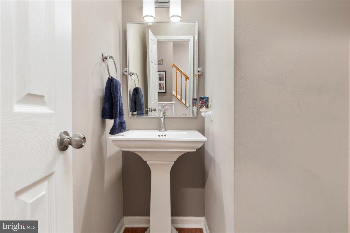 8236 Sunset Drive Manassas, VA 20110 - Photo 10 of 53 a bathroom with a sink and mirror