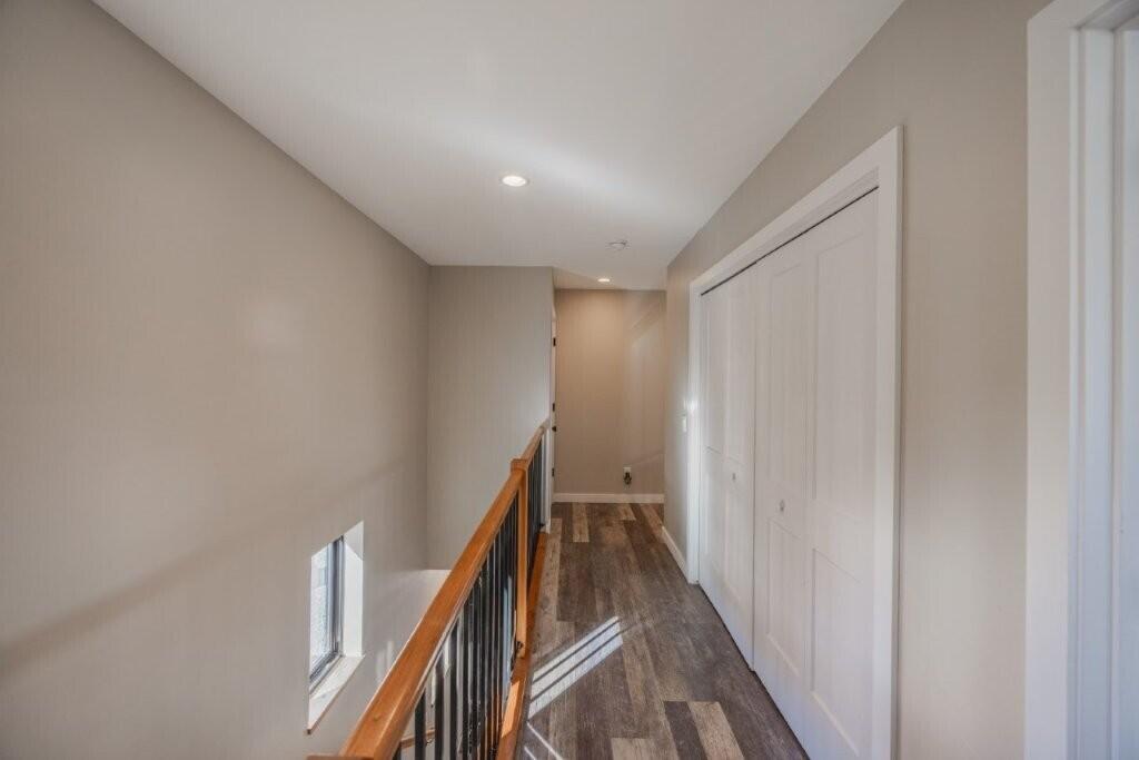 790 North Laura Street Ridgway, CO 81432 - Photo 19 of 42 a view of a hallway with wooden floor and stairs
