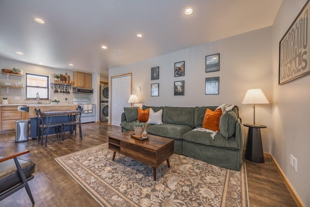 790 North Laura Street Ridgway, CO 81432 - Photo 21 of 42 a living room with furniture a rug and a table