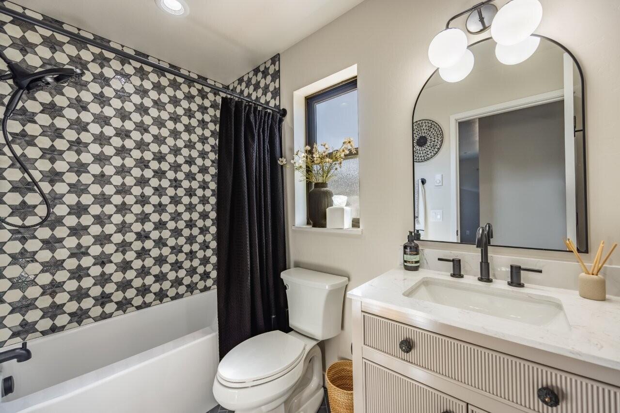 790 North Laura Street Ridgway, CO 81432 - Photo 30 of 42 a bathroom with a sink a toilet and shower