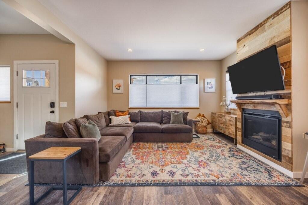 790 North Laura Street Ridgway, CO 81432 - Photo 5 of 42 a living room with furniture a fireplace and a flat screen tv