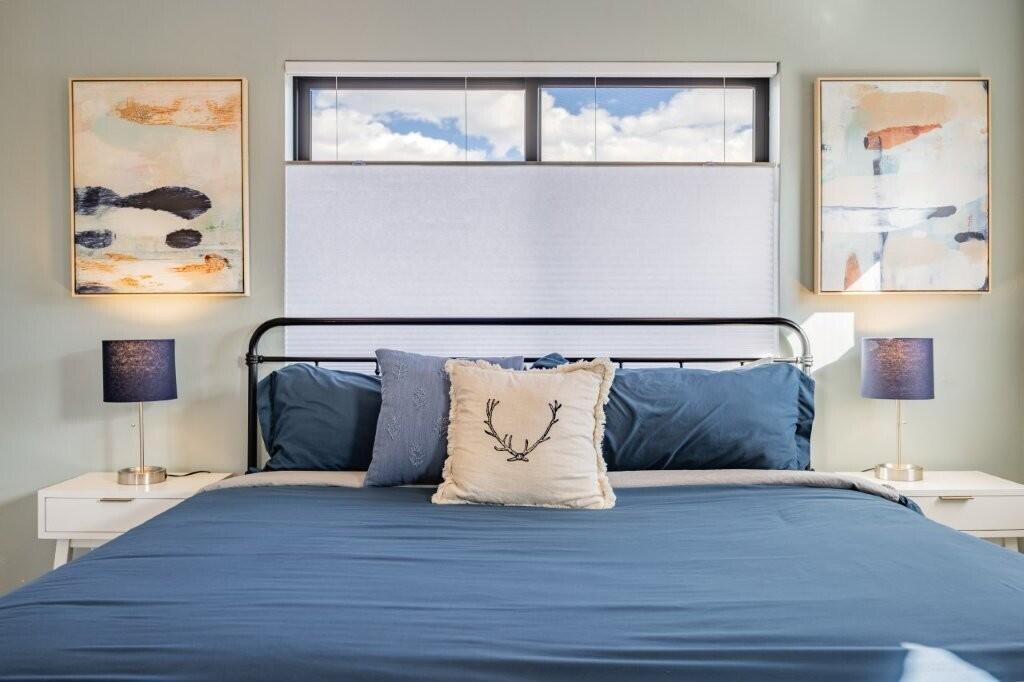 790 North Laura Street Ridgway, CO 81432 - Photo 6 of 42 a large bed sitting next to a lamp