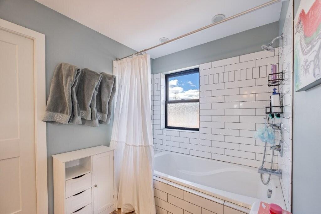 790 North Laura Street Ridgway, CO 81432 - Photo 9 of 42 a bathroom with a bathtub and a shower