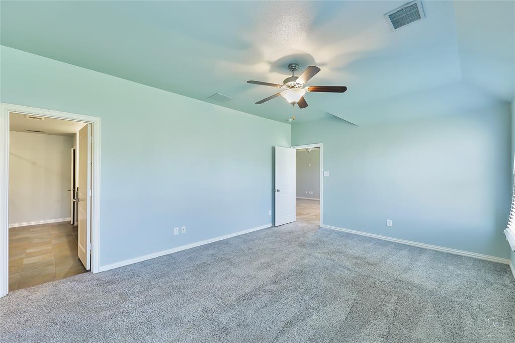 6601 Pine Hills Lane Denton, TX 76210 - Photo 18 of 23 Unfurnished bedroom with carpet and a ceiling fan