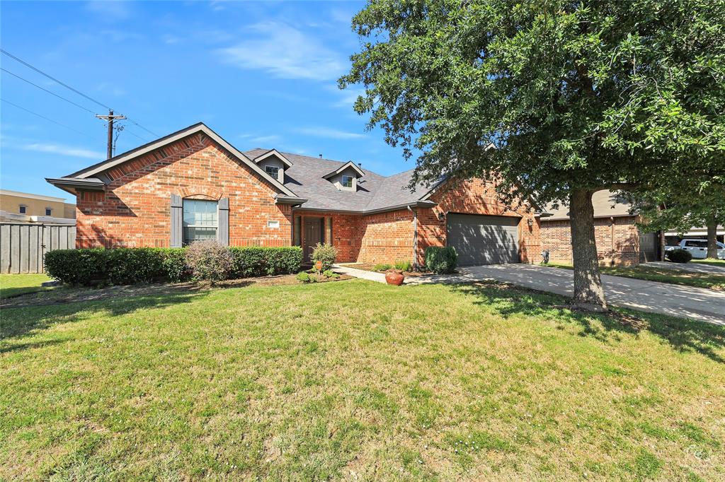 6601 Pine Hills Lane Denton, TX 76210 - Photo 2 of 23 View of front of house featuring brick siding, asphalt driveway, and a garage