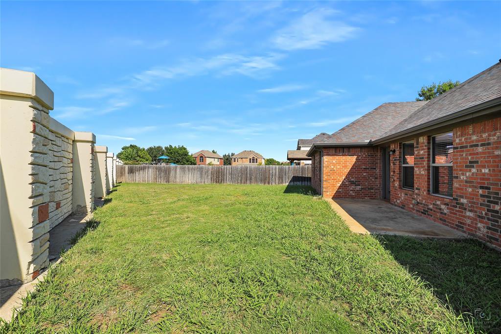 6601 Pine Hills Lane Denton, TX 76210 - Photo 23 of 23 Fenced backyard with a patio