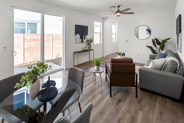 a living room with furniture potted plant and a window