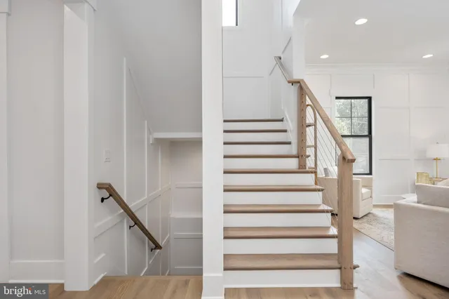a view of an entryway with wooden floor