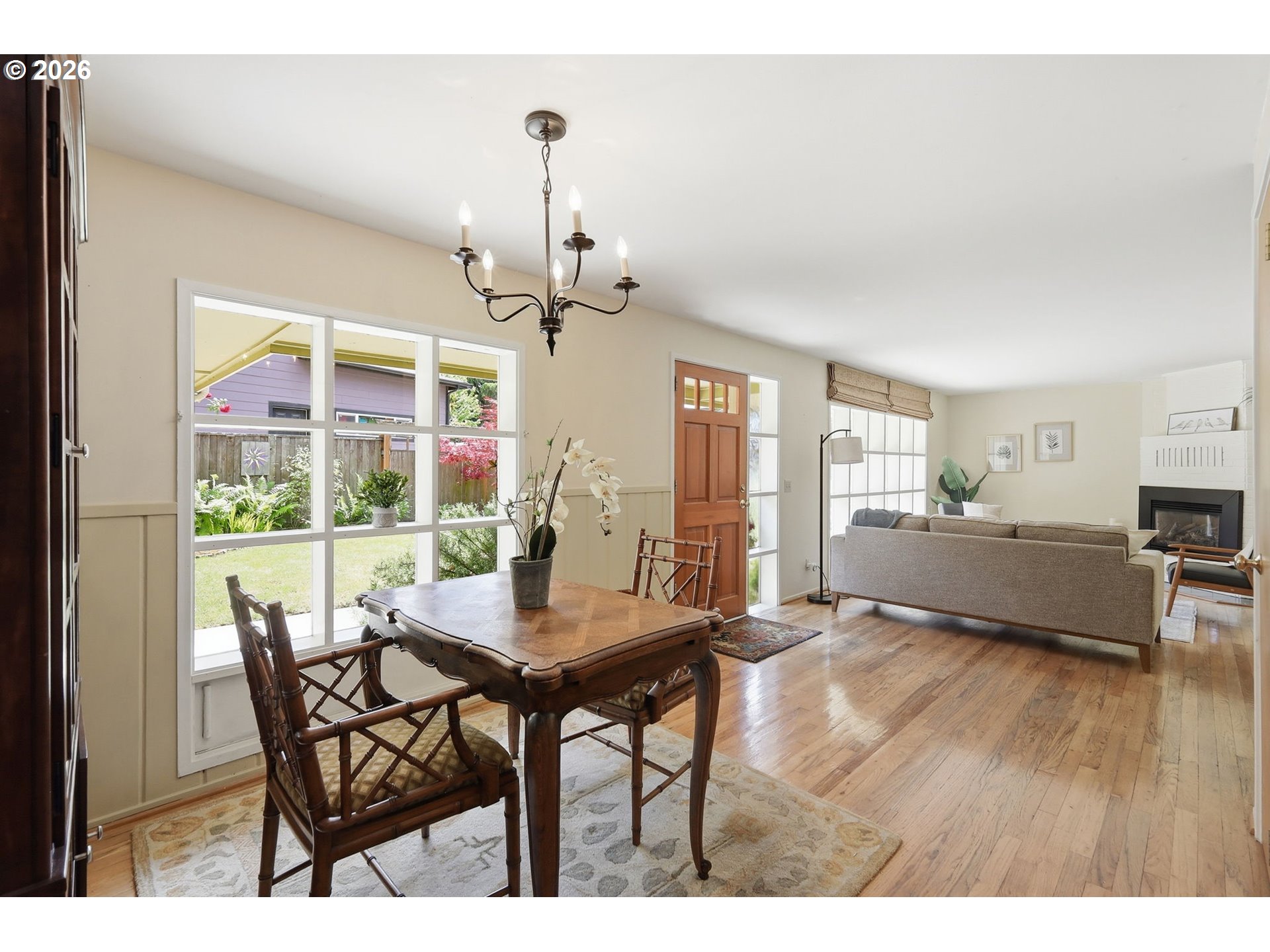 3025 Harris Street Eugene, OR 97405 - Photo 13 of 44 a view of a dining room with furniture wooden floor and a chandelier