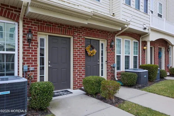 a kitchen with stainless steel appliances granite countertop wooden cabinets and a stove top oven