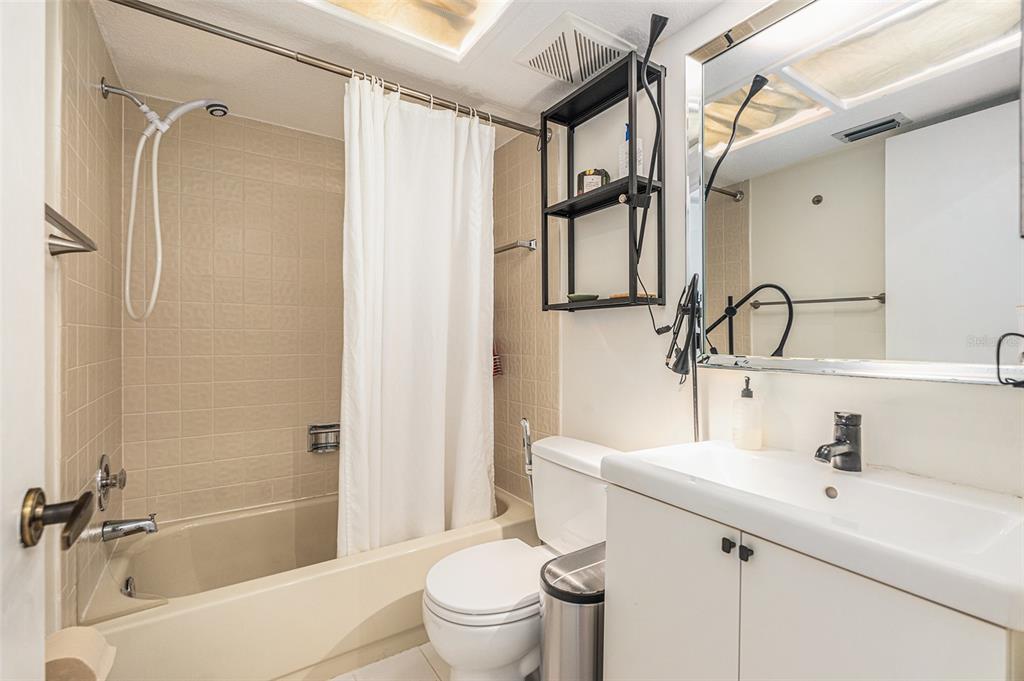 2368 Flanders Way, Unit D Safety Harbor, FL 34695 - Photo 19 of 25 a bathroom with a sink toilet and shower