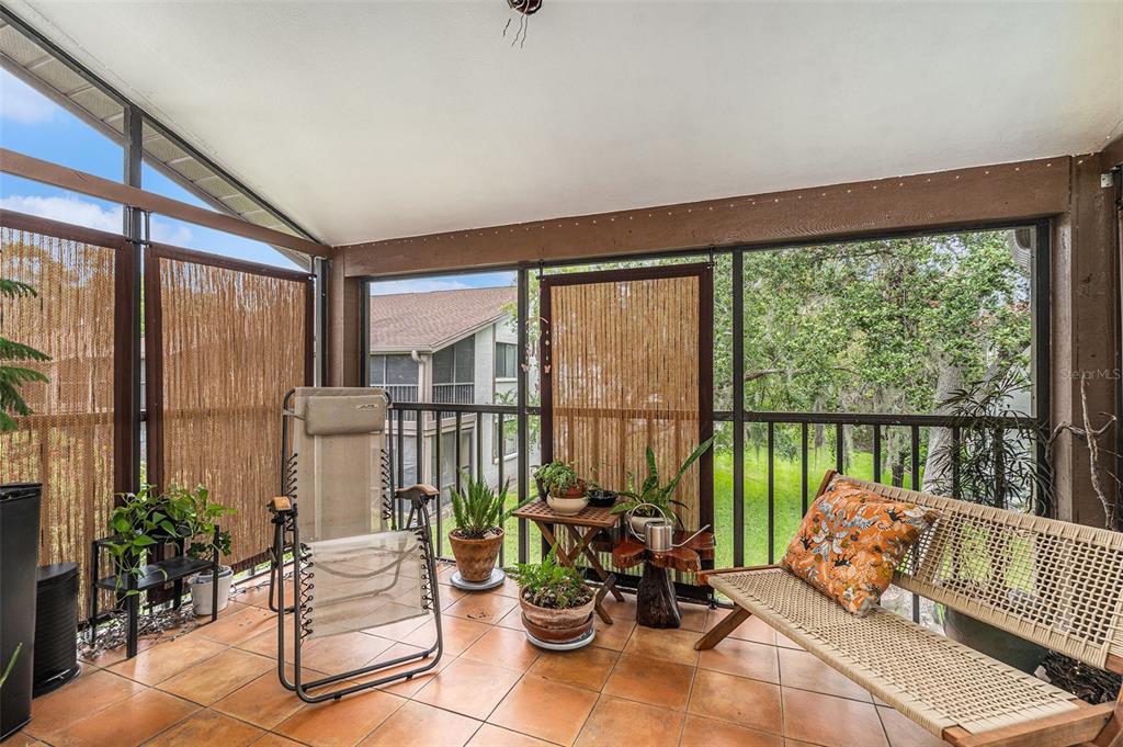 2368 Flanders Way, Unit D Safety Harbor, FL 34695 - Photo 20 of 25 a balcony with furniture and a potted plant