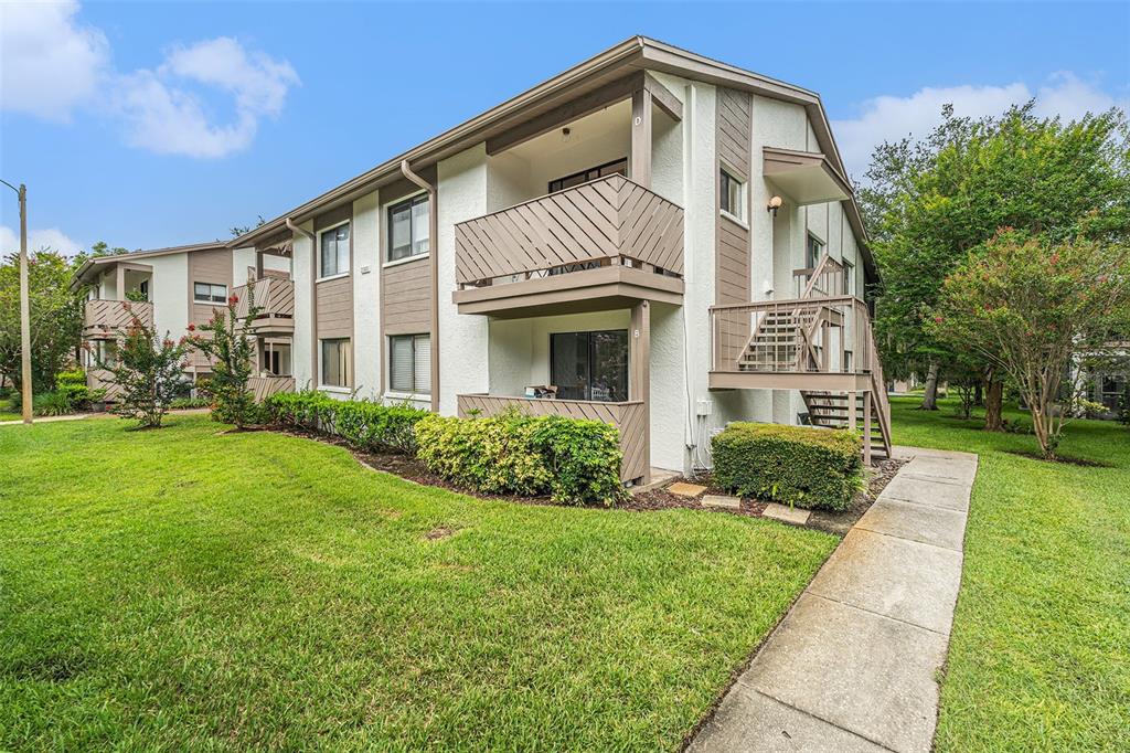 2368 Flanders Way, Unit D Safety Harbor, FL 34695 - Photo 2 of 25 a front view of a house with garden