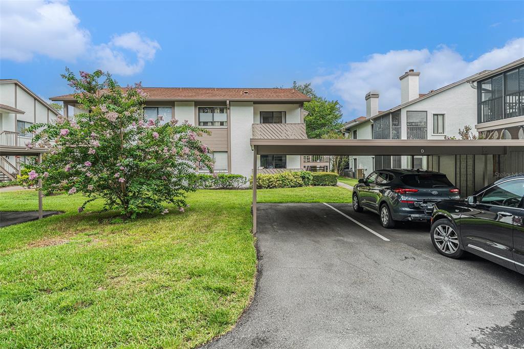 2368 Flanders Way, Unit D Safety Harbor, FL 34695 - Photo 22 of 25 a view of a car park in front of house