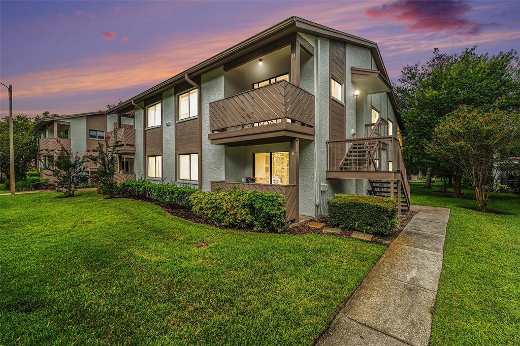 2368 Flanders Way, Unit D Safety Harbor, FL 34695 - Photo 24 of 25 a front view of a house with a yard