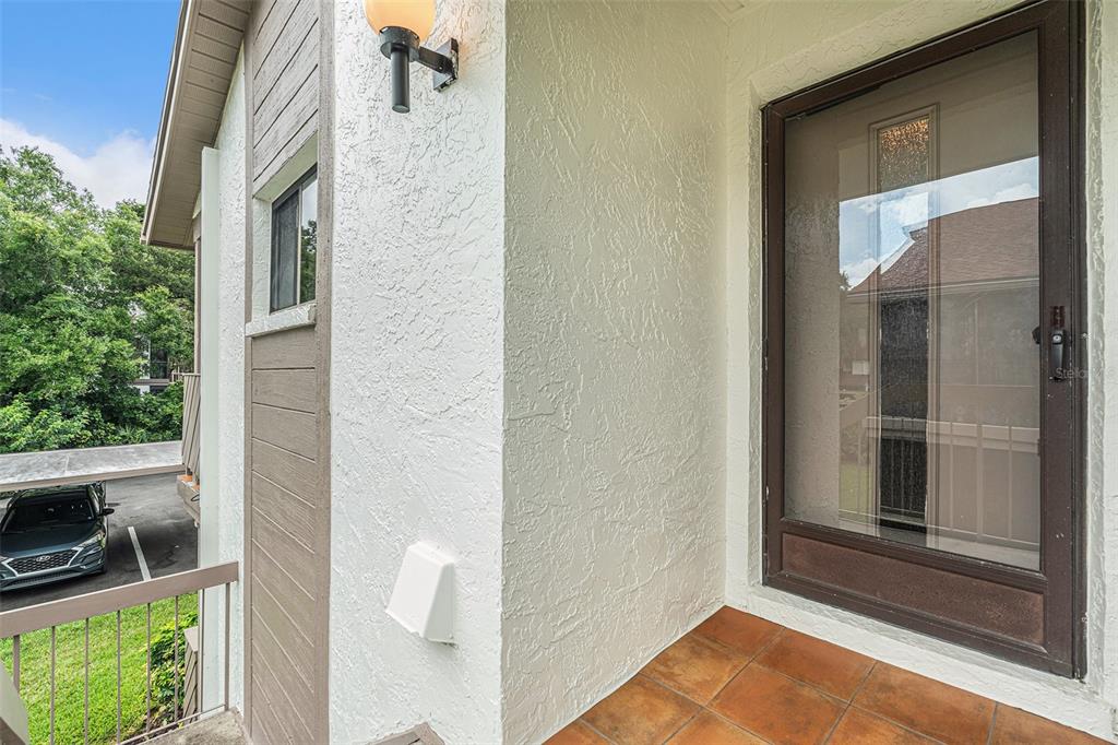 2368 Flanders Way, Unit D Safety Harbor, FL 34695 - Photo 3 of 25 a view of outdoor space deck and kitchen