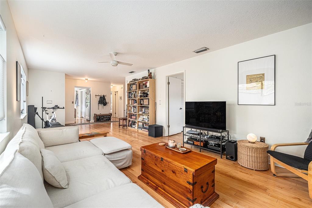 2368 Flanders Way, Unit D Safety Harbor, FL 34695 - Photo 7 of 25 a living room with furniture and a flat screen tv
