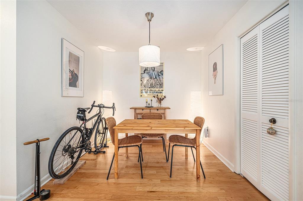 2368 Flanders Way, Unit D Safety Harbor, FL 34695 - Photo 10 of 25 a view of a dining room with furniture window and wooden floor