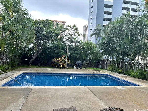 a view of swimming pool with a yard