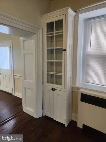 a view of front door with wooden floor